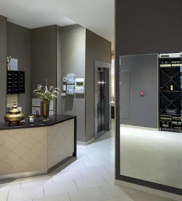 a tasting room with a counter and a wine cellar at Hotel Banja Luka in Banja Luka