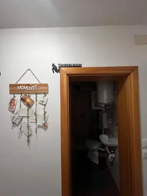 a bathroom door with a sign that reads newsagents at ALBAK Green Zone in Gradačac