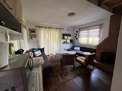 a living room with a couch and a table at ALBAK Green Zone in Gradačac