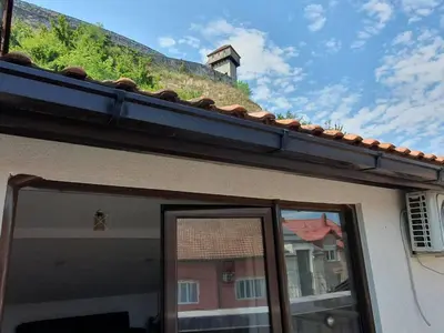 a roof of a house with a building at Apartman Gradina in Doboj