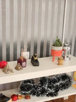 a shelf with christmas decorations on top of it at Stan na dan Nova Varoš in Banja Luka