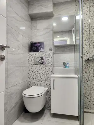 a bathroom with a toilet and a sink at Stan na dan Nova Varoš in Banja Luka