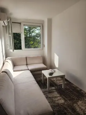 a living room with a couch and a table at Stan na dan Nova Varoš in Banja Luka