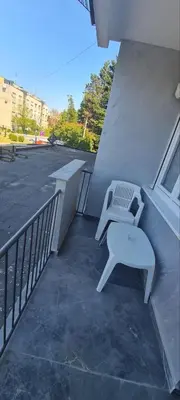 a white bench sitting on the side of a building at LARA S in Banja Luka