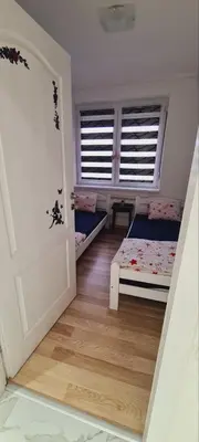 a small room with a bed and a window at LARA S in Banja Luka
