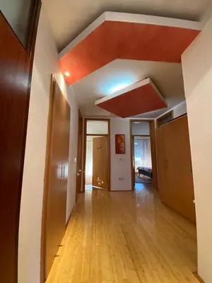 an empty living room with a red ceiling at Apartman GOGO in Livno