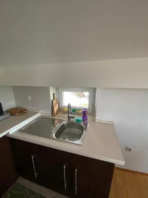 a kitchen with a sink and a counter top at Apartman GOGO in Livno