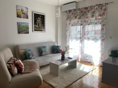 a living room with a couch and a table at Alexandra apartment in Banja Luka