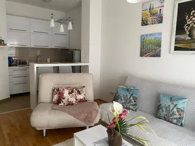 a living room with a couch and a table at Alexandra apartment in Banja Luka