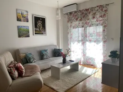 a living room with a couch and a table at Alexandra apartment in Banja Luka