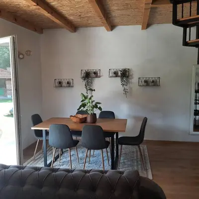 a dining room with a table and chairs at Holiday home Dani in Bihać