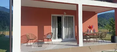 a patio with chairs and a table on a porch at Holiday home Dani in Bihać