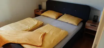 a bedroom with a bed with two pillows on it at Holiday home Dani in Bihać