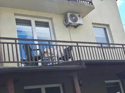 a balcony with a air conditioner on a building at Apartmani Villas in Visoko