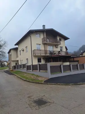 a large building with balconies on the side of it at Apartmani Villas in Visoko