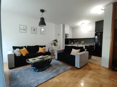 a living room with a couch and a table at Apartman Hajduković in Banja Luka