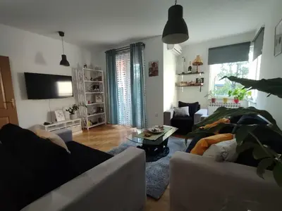 a living room with two couches and a table at Apartman Hajduković in Banja Luka