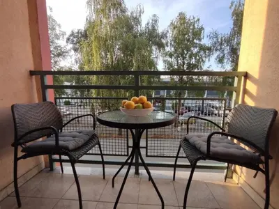 a table with a bowl of fruit on a balcony at Apartman Hajduković in Banja Luka