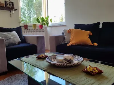 a living room with a coffee table with food on it at Apartman Hajduković in Banja Luka