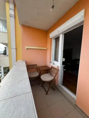 a room with a table and two chairs and a window at Apartment Sunny day in Livno