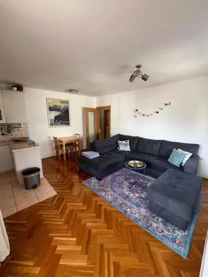a living room with a couch and a table at Apartment Sunny day in Livno