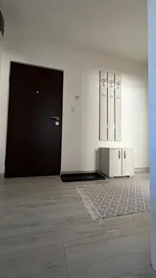 an empty room with a black door and a rug at Apartman “ Ismar “ in Travnik