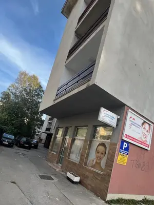 a building with a picture of a girl in the window at Apartman “ Ismar “ in Travnik