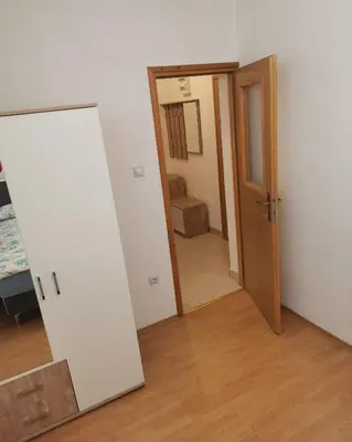 an empty room with a door and a hallway at Stan na dan Grahovo in Bosansko Grahovo