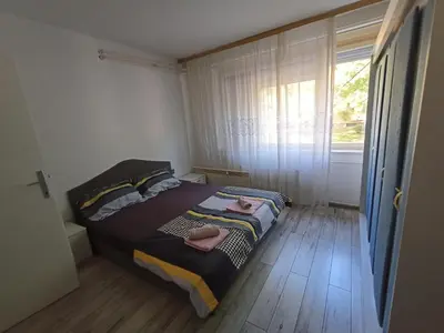 a bedroom with a bed with two towels on it at Apartmani Vesna in Banja Luka