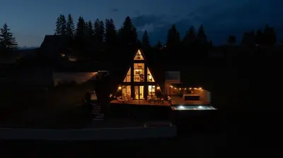 a large house lit up at night with lights at Euphoria - luxury villa in Vlasic