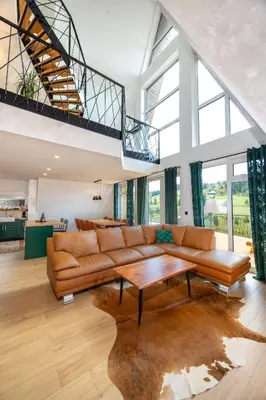 a living room with a couch and a table at Euphoria - luxury villa in Vlasic