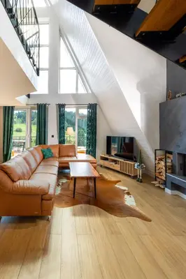a living room with a couch and a table at Euphoria - luxury villa in Vlasic