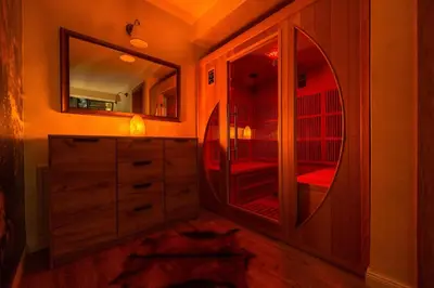 a bathroom with a dresser and a mirror at Euphoria - luxury villa in Vlasic