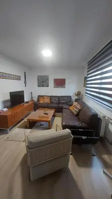 a living room with a couch and a table at AS Apartman Visoko in Visoko