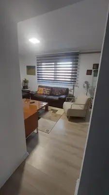 a living room with a couch and a table at AS Apartman Visoko in Visoko