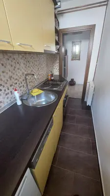 a kitchen with a sink and a counter top at AS Apartman Visoko in Visoko