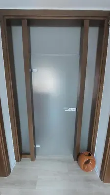 a closet with a glass door in a room at AS Apartman Visoko in Visoko