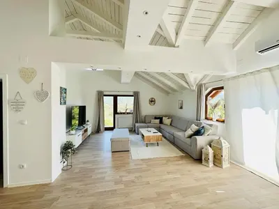 a living room with a couch and a table at Vila Milincic Milincic Nest in Banja Luka
