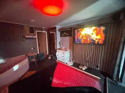 a room with a bed and a tv on the wall at Apartman Banja Luka CITY in Banja Luka