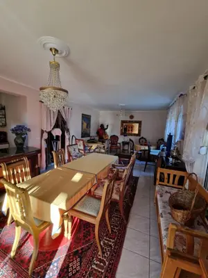 a dining room with a table and chairs at Stara Ruža in Gračanica
