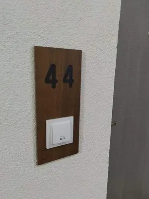 a lightswitch with the number four on a wall at APARTMAN ANIKA - STAN NA DAN Doboj in Doboj