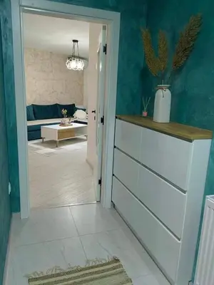 a hallway with a room with a living room at APARTMAN ANIKA - STAN NA DAN Doboj in Doboj