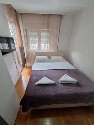 a bedroom with two beds with pillows on it at Luks 2 apartment in Banja Luka