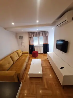a living room with a couch and a flat screen tv at Luks 2 apartment in Banja Luka