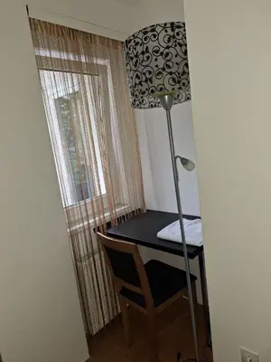 a room with a desk and a lamp and a window at Luks 2 apartment in Banja Luka