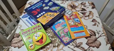 a group of childrens books sitting on top of a crib at Vikendica 