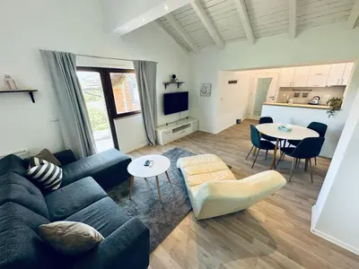 a living room with a couch and a table at Vila Milincic Loft Milincic in Banja Luka