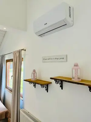 a room with two wooden shelves on the wall at Vila Milincic Loft Milincic in Banja Luka