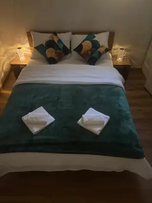 a bed with two towels on top of it at Villa Tea - Slatina in Laktaši
