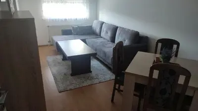 a living room with a couch and a table at CityLux Doboj in Doboj